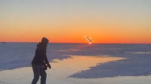 Adventures on ice: Meet a woman snowmobiling, ice skating, and cooking out on Lake Erie