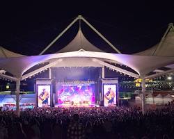 Walmart AMP Rogers Arkansas outdoor concert night, AI generated