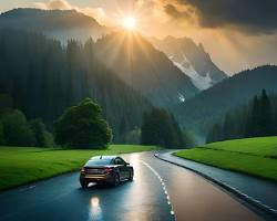 Image of car on a highway with mountains in the background