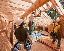 Image of person building a house