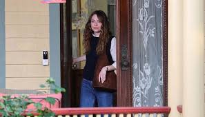 What does Emma Stone's outfit on set of The Catch say about the story?