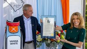 NMB honors Vanna White with personalized golf bag, plaque