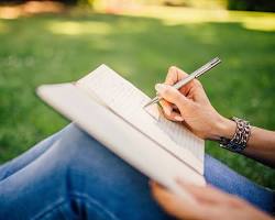 Image of person writing a poem