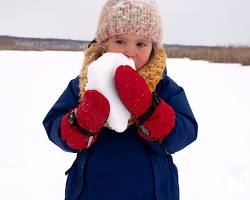 Image of person wearing a swimsuit and holding a snowball