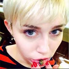 Miley Cyrus Gets Sad Kitty Tattoo on Her Inner Lip. By Kabita Maharana - miley-cyrus-gets-sad-kitty-tattoo