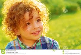 Cute baby boy on green field - cute-baby-boy-green-field-closeup-portrait-curly-hair-having-fun-outdoors-enjoying-summer-vacation-happy-childhood-32669896