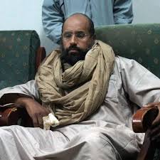 Image result for hillary clinton with gaddafi son