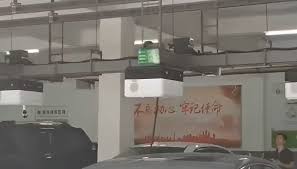 China Tests Ceiling-Mounted Robot That Charges EVs Automatically