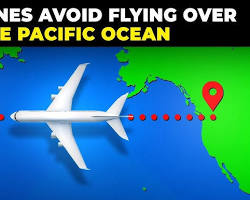Image of plane flying over the Pacific Ocean