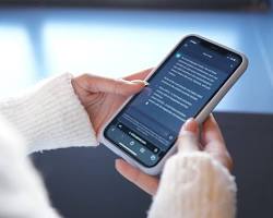 صورة person using mobile phone to browse the internet