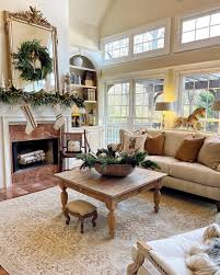 Here are some more shots of the great room decorated for Christmas. I love filling a big bowl like this antique dough bowl with greenery, pine cones, ornaments and feathers. I included