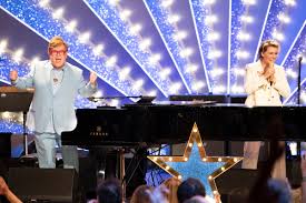 Elton John and Brandi Carlile Dazzle at Star-Studded London Palladium Show