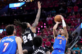 Julian Champagnie scores an incredible basket during a game