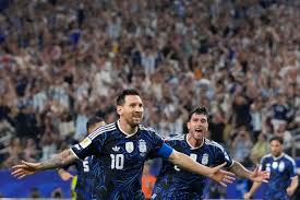 Lionel Messi celebrates scoring for Argentina