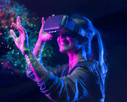 Image of person wearing a VR headset and interacting with a virtual environment