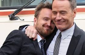 image of actors Bryan Cranston and Aaron Paul standing in front of the RV and hugging - bb2