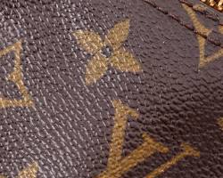 closeup of the iconic Louis Vuitton monogram patternの画像