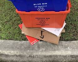 Image of recycling bin filled with paper, plastic, and metal