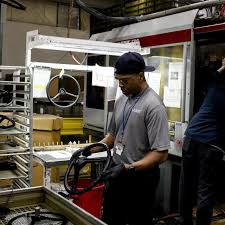 Automakers Respond to Trump Tariffs: Layoffs, Pauses, and Price Strategies