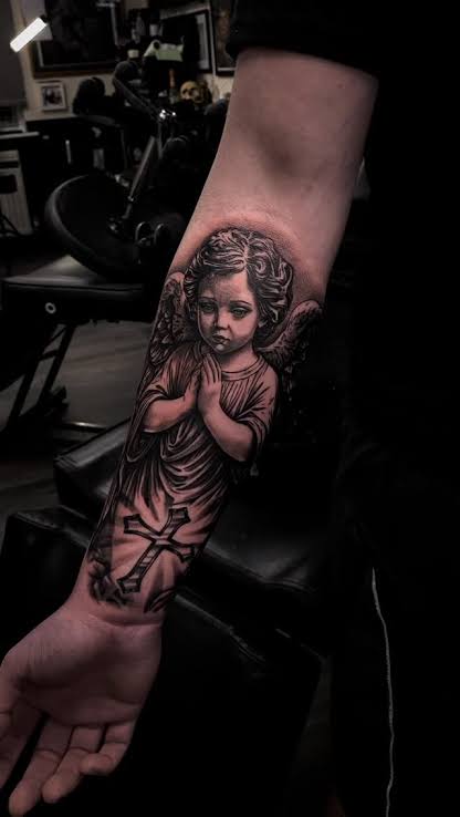 Fine line black and grey praying cherub tattoo ...