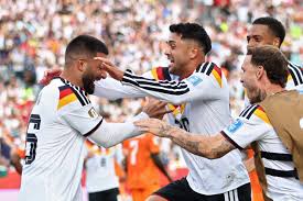 Germany secures place in knockout rounds for first time since lifting cup in 2014