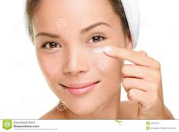 Face cream woman applying skin cream under eyes. Beauty eye contour cream, wrinkle cream or anti-aging skin care cream. Beautiful young mixed race Asian ... - face-cream-woman-28020702