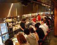 person enjoying solo yakiniku at a counter seatの画像
