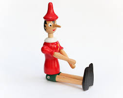Risultati immagini per pinocchio statuetta di legno vendita