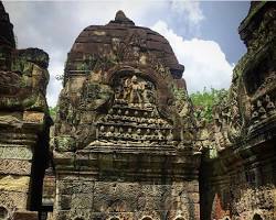 Image of intricate basreliefs adorning the walls of Angkor Wat, depicting scenes from Hindu mythology