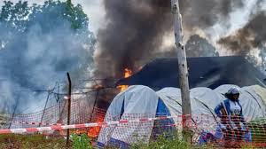 Angry crowd sets Ebola hospital tents on fire in DR Congo