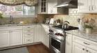 White kitchen cabinets with white granite countertops 