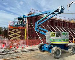 Image of construction site with a cherry picker