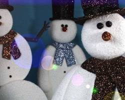 Image of snowmen with various props