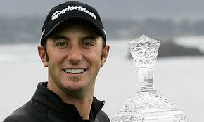 Dustin Johnson holds up his trophy on the 18th green after winning the AT&amp;T Pebble Beach National Pro-Am tournament. Photograph: Jeff Chiu/AP - Dustin-Johnson-001