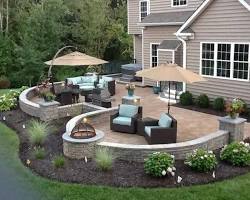 Image of beautifully landscaped backyard with a patio and outdoor seating