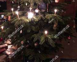 Imagine cu Christmas tree with sparklers