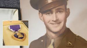 A Purple Heart awarded to a fallen World War II soldier that ended up stuffed inside a box at a New York Goodwill store will be returned to the veteran&#39;s ... - ap_roland_purple_heart_split_kb_130813_16x9_608