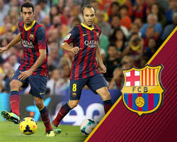 Image of Xavi Hernandez playing for Barcelona with Iniesta and Busquets