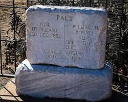 Image of weathered tombstone in a cemetery, inscribed with the name Billy the Kid