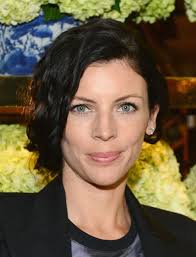 Liberty Ross&#39; Curly Faux Bob Hairstyle. We&#39;re living for Liberty Ross&#39; side parted faux bob coif with curls! One side is lifted and pinned higher than the ... - Liberty-Ross-Loose-UpdoSide-Part-Hairstyle-2014