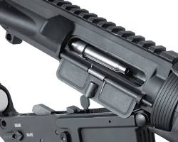 AR15 bolt carrier group disassembled, highlighting its components. A tactical image from Unsplash.的图片