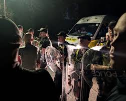 Far-right protesters descend on Portsmouth after small boat arrival — The Guardian