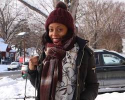 Image of Winter outfit with puffer jacket, scarf, and hat