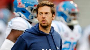 Charlie Weis Jr. Navigates Dual Coaching Roles Amid NFL Interest