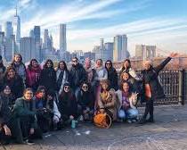 Image of New York City skyline with diverse group of people