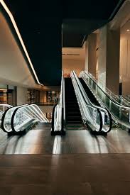 An escalator in a large building with two escalators - Free ...