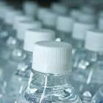 Pupils take drinking water school
