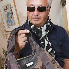 John Richard bought the Elvis Presley print bag by Philip Treacy in an Oxfam charity shop. Picture: Nigel Sutton - 2350285414