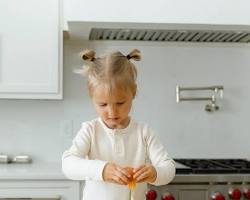 Image of Child cracking an egg