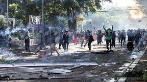 Indonesia police fire tear gas at protesters after driver's death